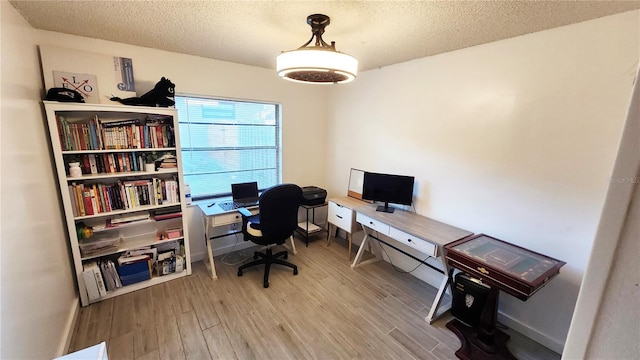 office featuring a textured ceiling and hardwood / wood-style flooring