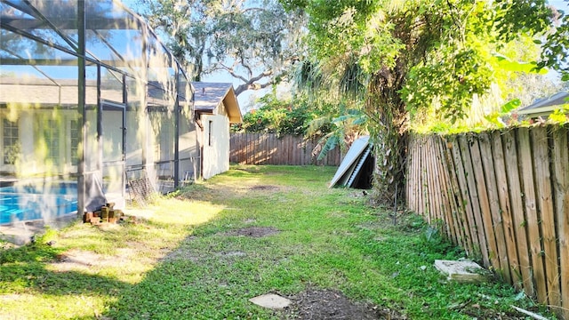 view of yard with a lanai