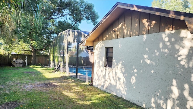 view of property exterior with a yard