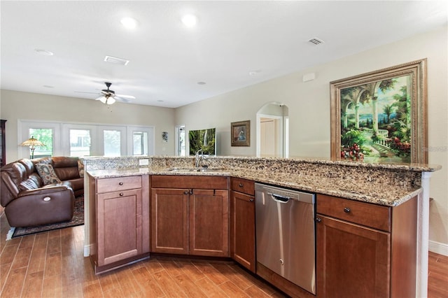 kitchen featuring light hardwood / wood-style flooring, dishwasher, and ceiling fan