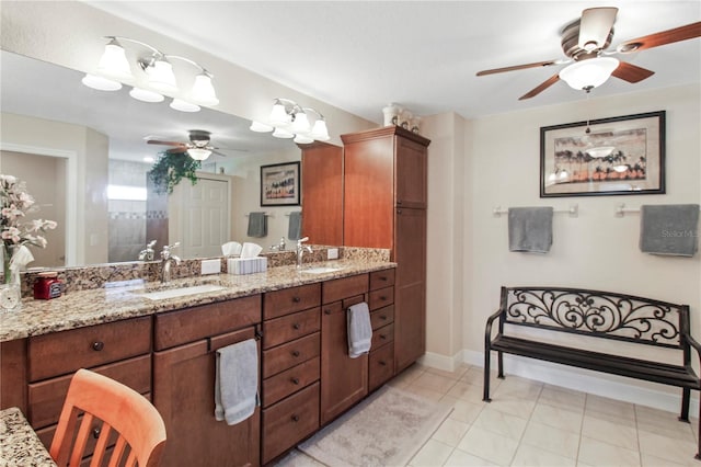 bathroom with tile patterned floors, ceiling fan, walk in shower, and vanity