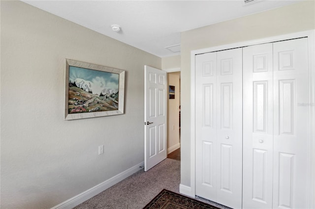 unfurnished bedroom featuring carpet flooring and a closet