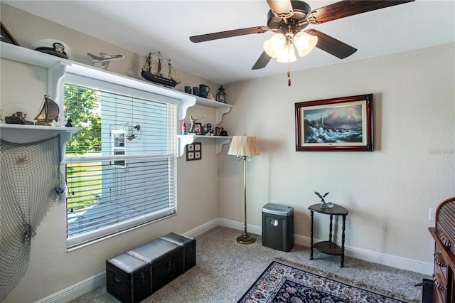 interior space featuring ceiling fan and carpet flooring