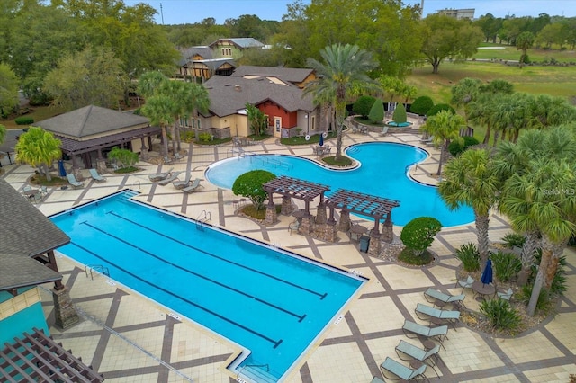 view of swimming pool featuring a patio area