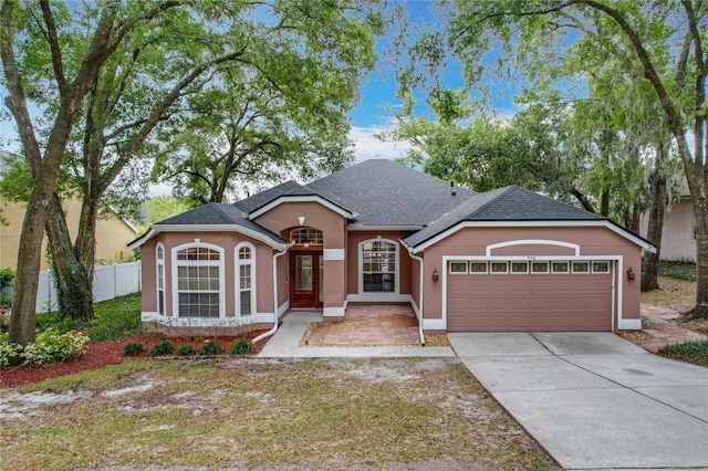 single story home featuring a garage