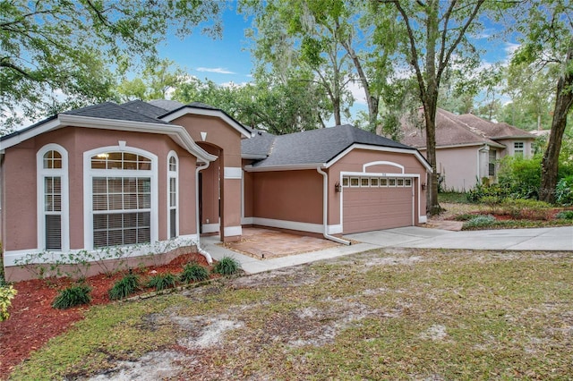 single story home with a garage