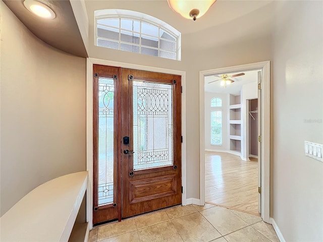 entrance foyer with light hardwood / wood-style floors, a healthy amount of sunlight, and ceiling fan