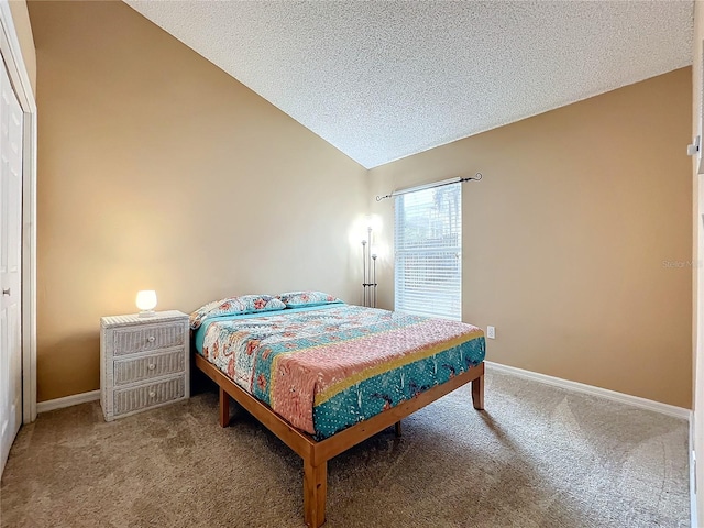 bedroom with a textured ceiling, vaulted ceiling, carpet flooring, and a closet