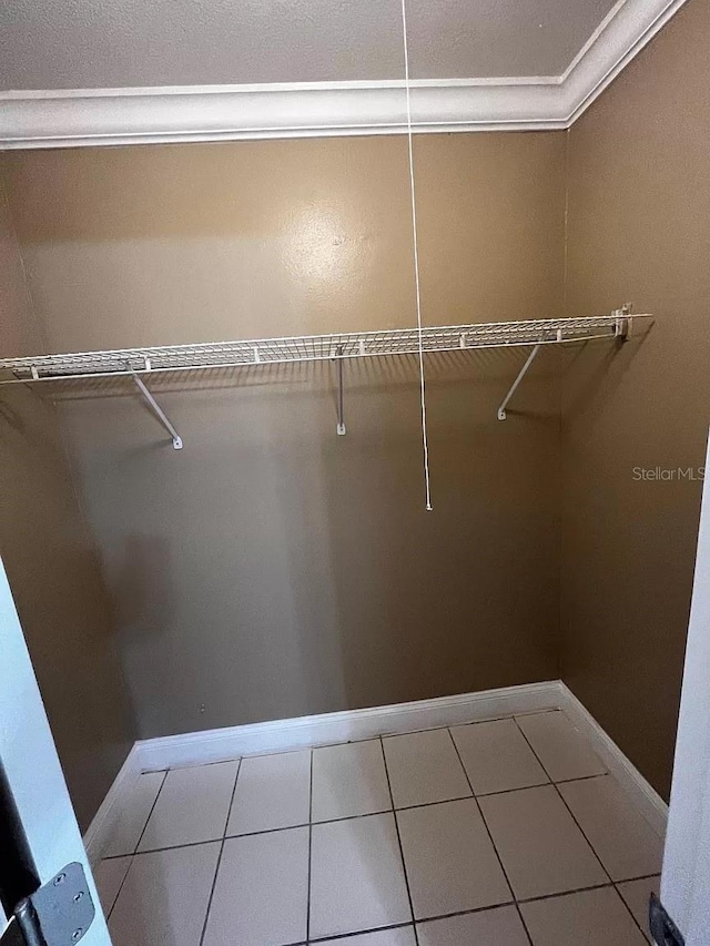 spacious closet with tile patterned flooring