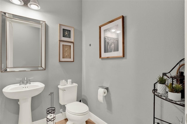 bathroom featuring sink and toilet