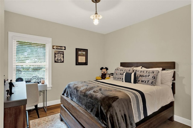 bedroom with hardwood / wood-style floors