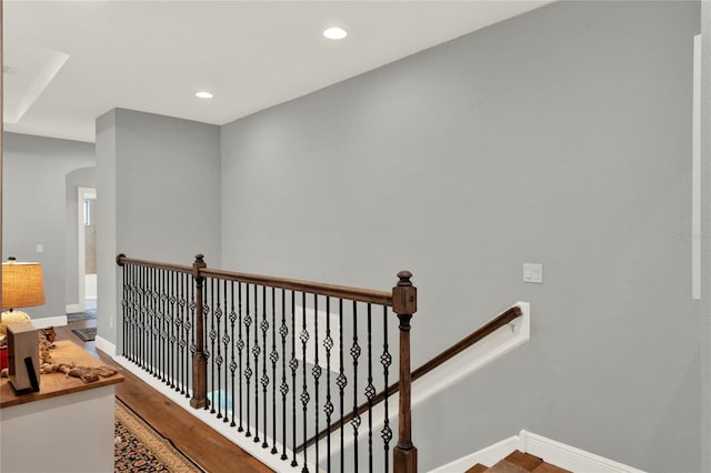 staircase featuring hardwood / wood-style floors