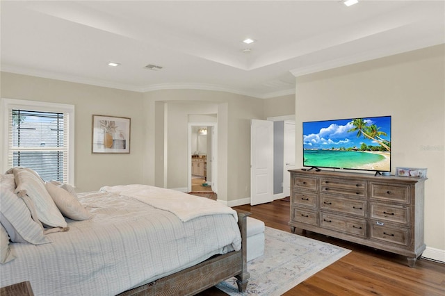 bedroom featuring crown molding and dark hardwood / wood-style flooring