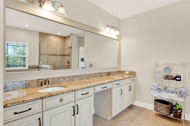 bathroom with tile patterned flooring, vanity, and a shower with shower door