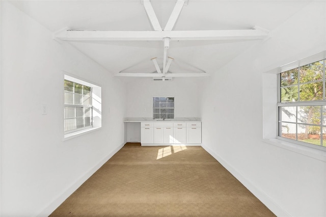 interior space featuring beamed ceiling, light colored carpet, high vaulted ceiling, and ceiling fan