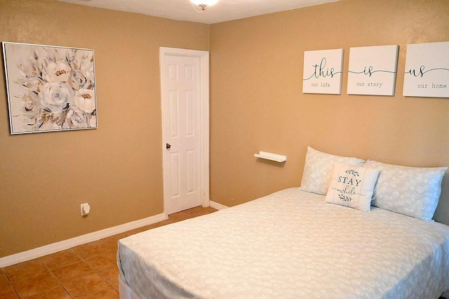 bedroom featuring tile patterned flooring