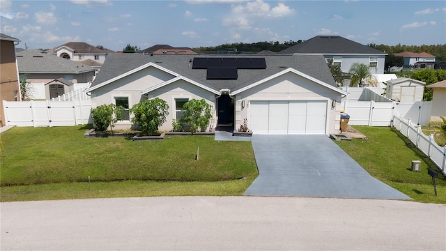 view of front of property with a front yard and a garage