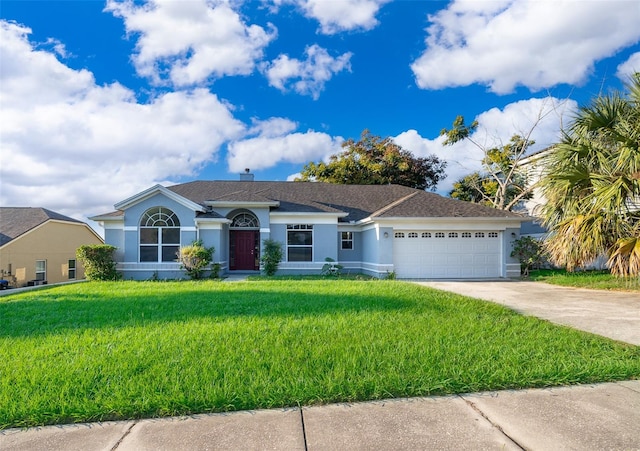 ranch-style home featuring a front lawn and a garage