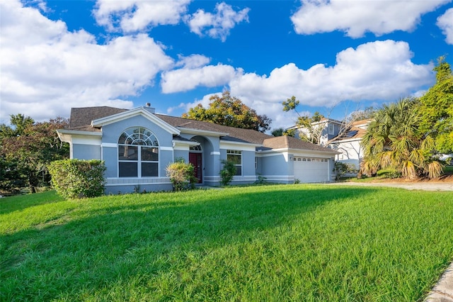 ranch-style home featuring a garage and a front yard