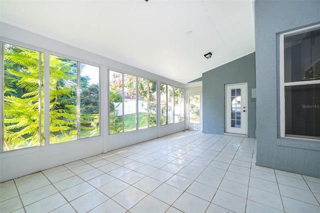 unfurnished sunroom with lofted ceiling and a healthy amount of sunlight