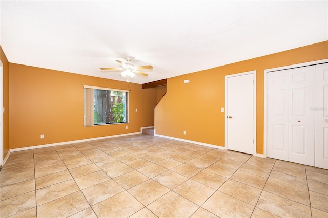 unfurnished bedroom with ceiling fan and light tile patterned floors