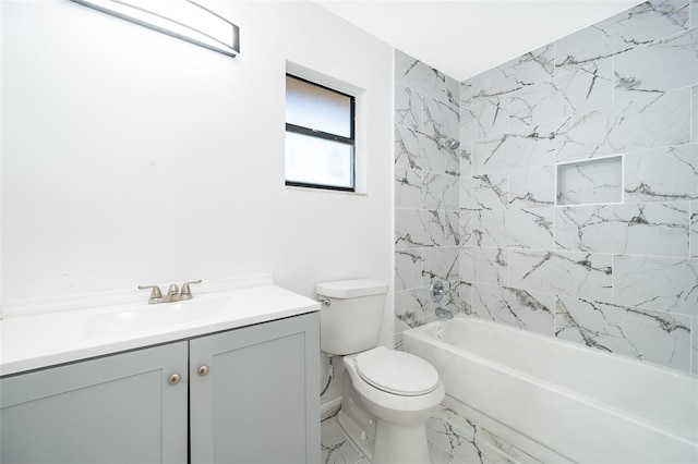 full bathroom featuring tiled shower / bath combo, vanity, and toilet