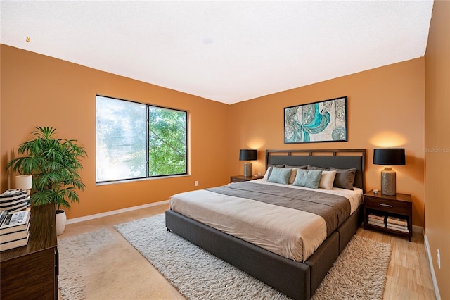 bedroom with light wood-type flooring