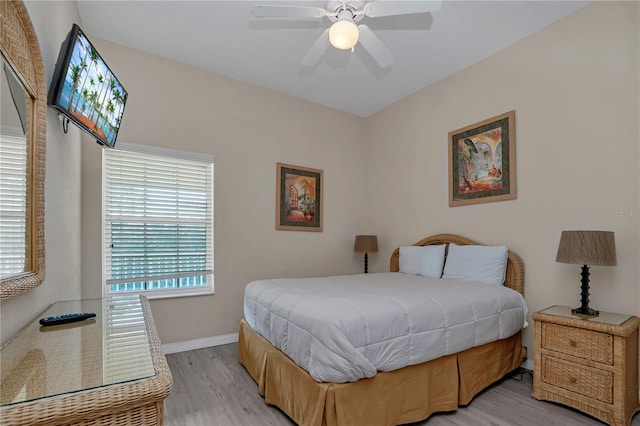 bedroom with light wood-type flooring and ceiling fan