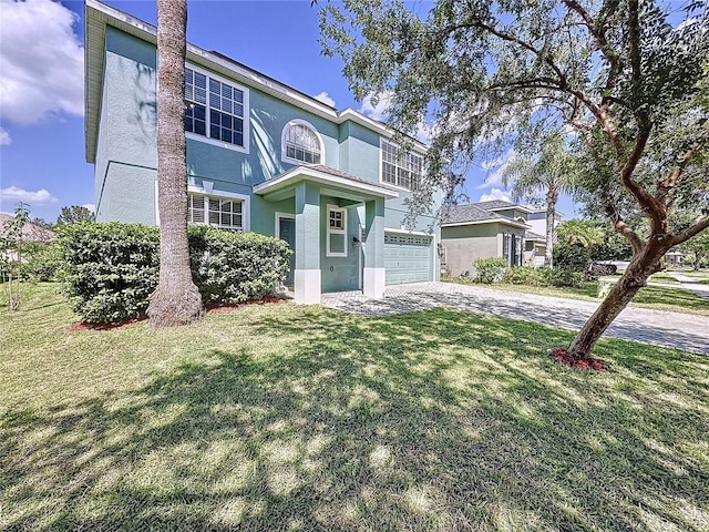 view of front of property featuring a front yard and a garage