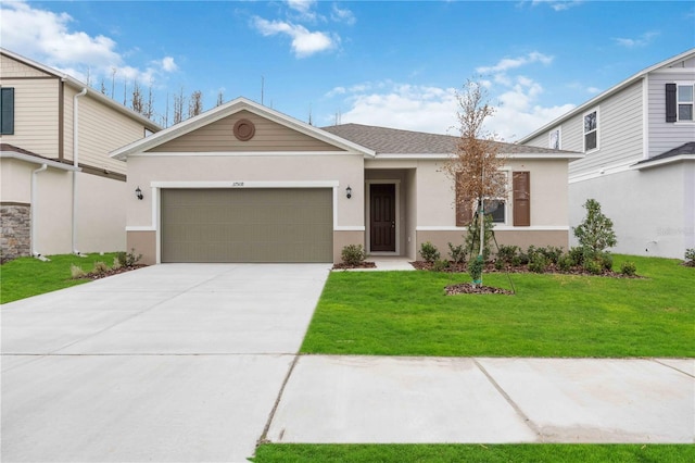 view of front of property with a garage and a front yard