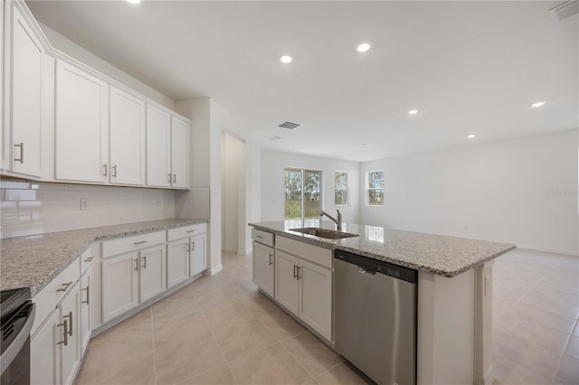 kitchen featuring sink, white cabinets, a kitchen island with sink, and stainless steel dishwasher