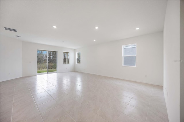 spare room with light tile patterned floors