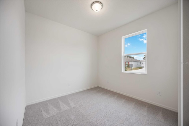 unfurnished room featuring carpet flooring