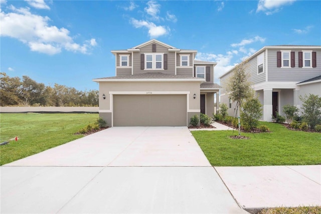 view of front of home featuring a garage and a front yard