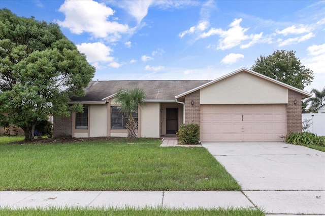 ranch-style home featuring a garage and a front lawn