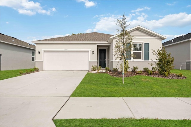 ranch-style home with a garage and a front yard