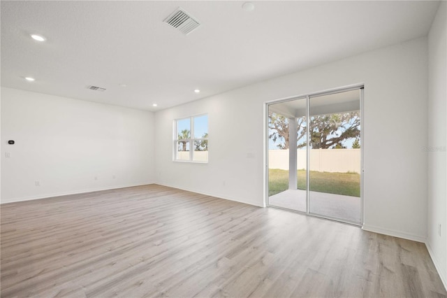 unfurnished room featuring light hardwood / wood-style flooring