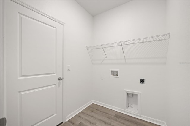 laundry room featuring hookup for a washing machine, electric dryer hookup, and hardwood / wood-style flooring