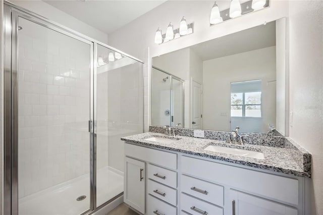 bathroom with vanity and walk in shower