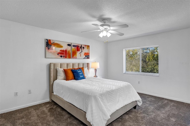 bedroom featuring a textured ceiling, carpet, a ceiling fan, and baseboards