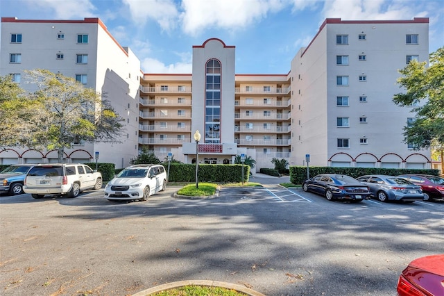 view of property with uncovered parking