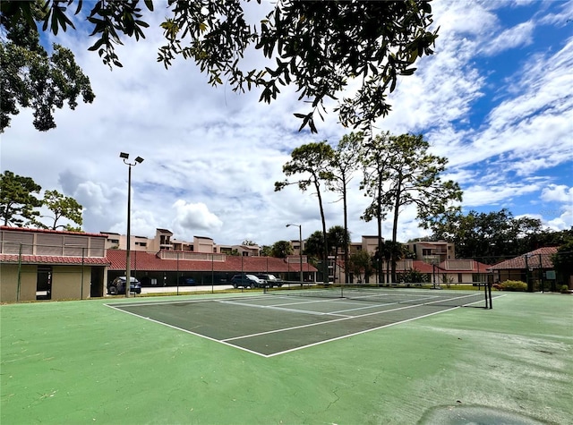 view of sport court with fence