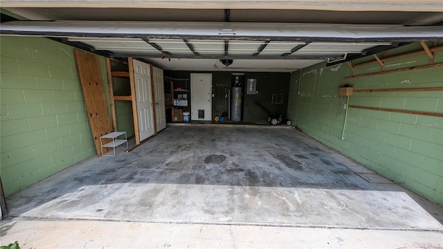 garage featuring a garage door opener and electric water heater