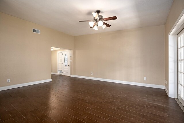 unfurnished room featuring ceiling fan and dark hardwood / wood-style flooring