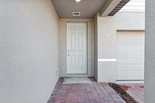 entrance to property with a garage