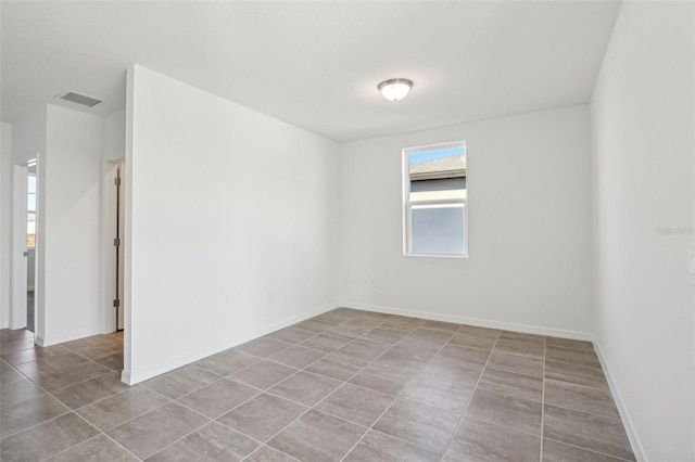 view of tiled spare room