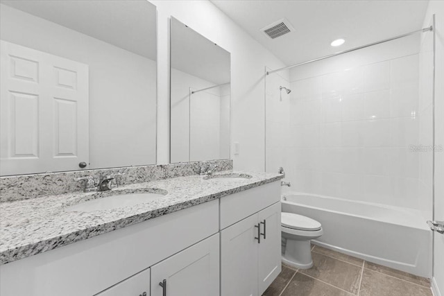 full bathroom with toilet, vanity, and tiled shower / bath combo