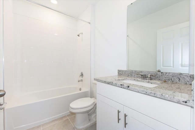 full bathroom with tiled shower / bath combo, vanity, toilet, and tile patterned floors