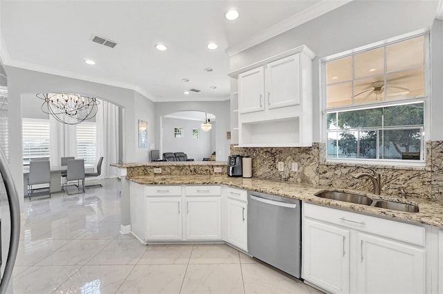 kitchen featuring stainless steel dishwasher, tasteful backsplash, white cabinets, sink, and crown molding