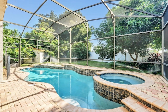 view of swimming pool featuring an in ground hot tub, a storage unit, glass enclosure, and a patio